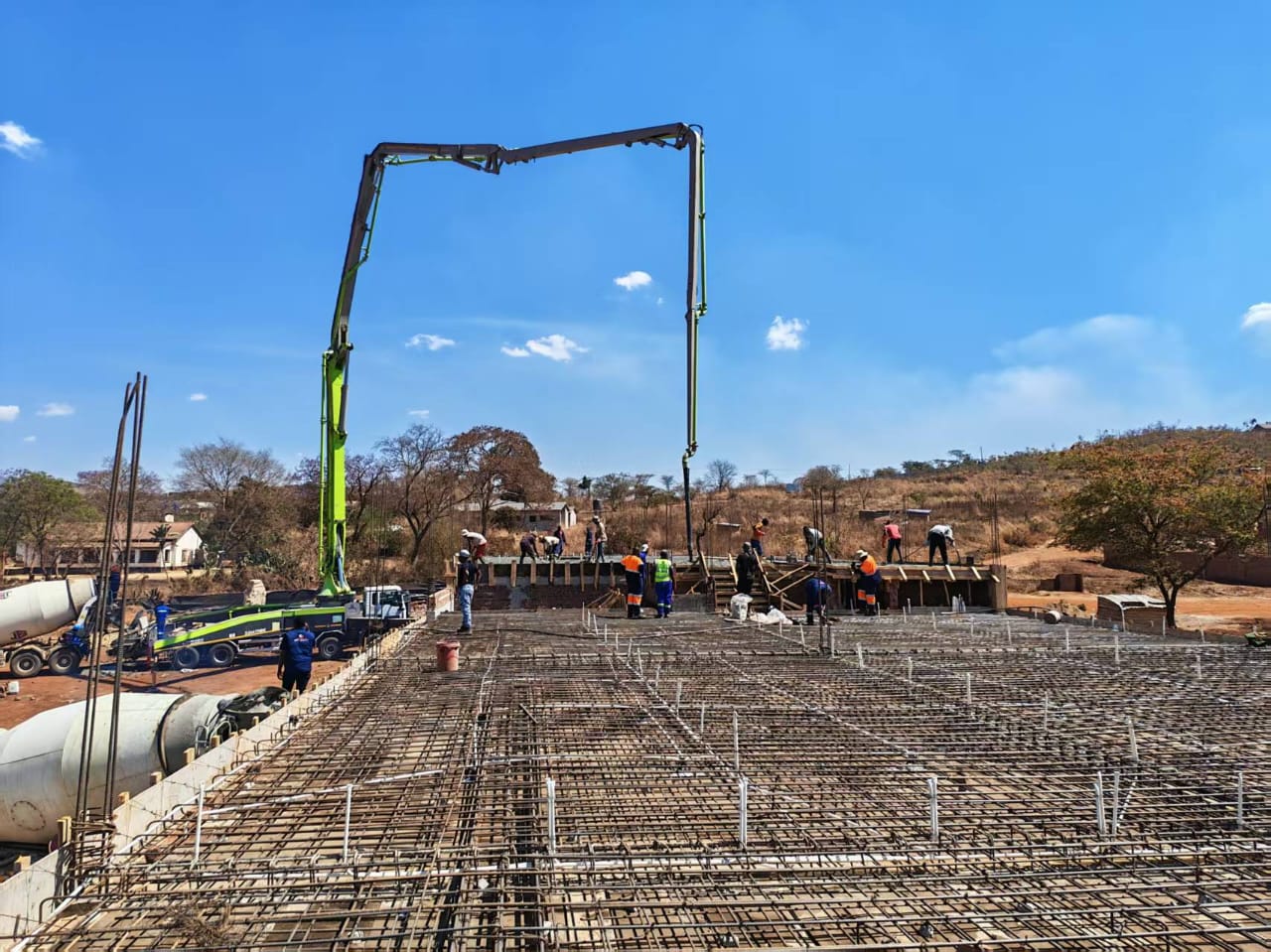 Concrete pump placing a large structural slab