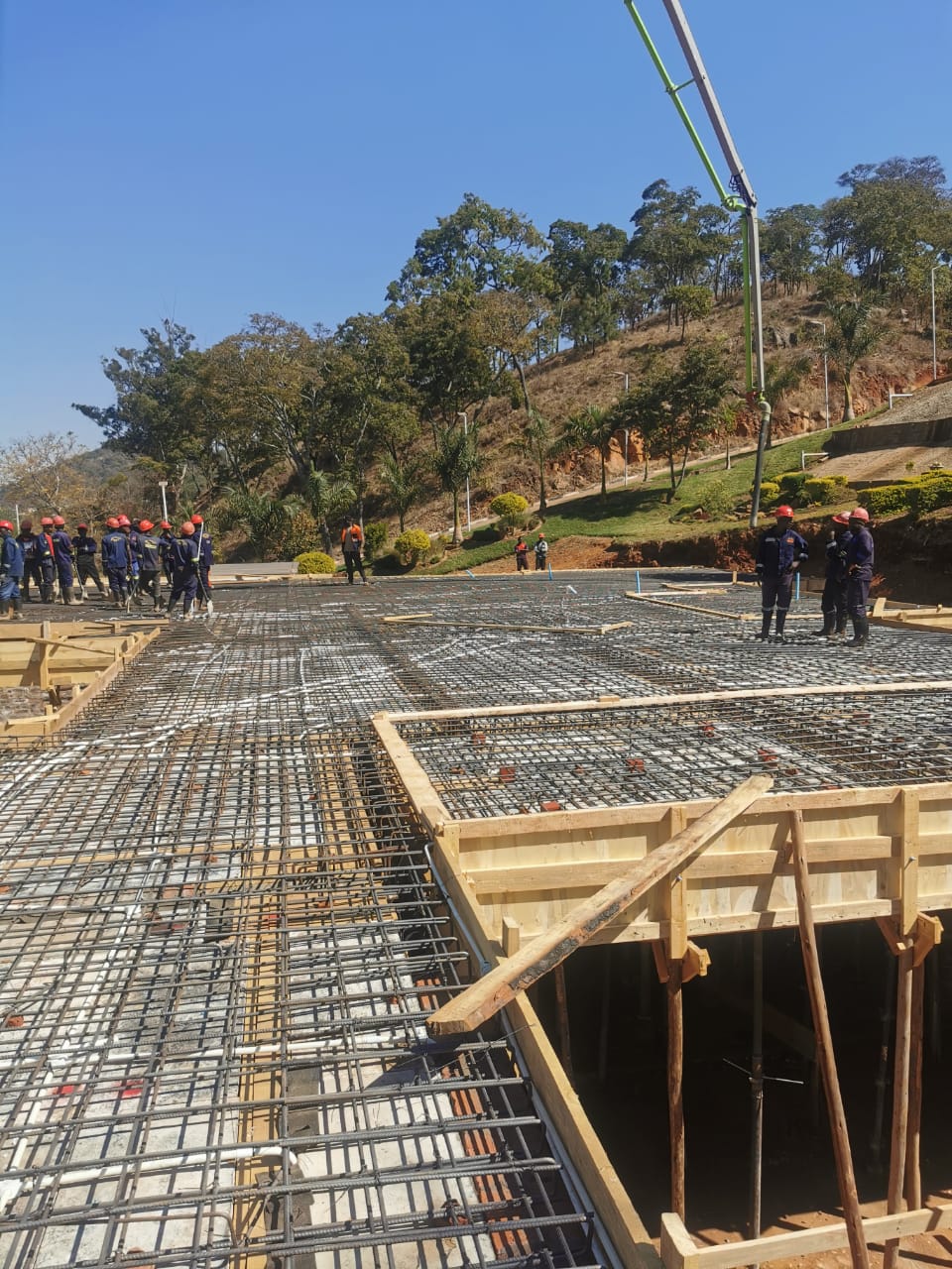 Concrete pump placing a reinforced structural slab